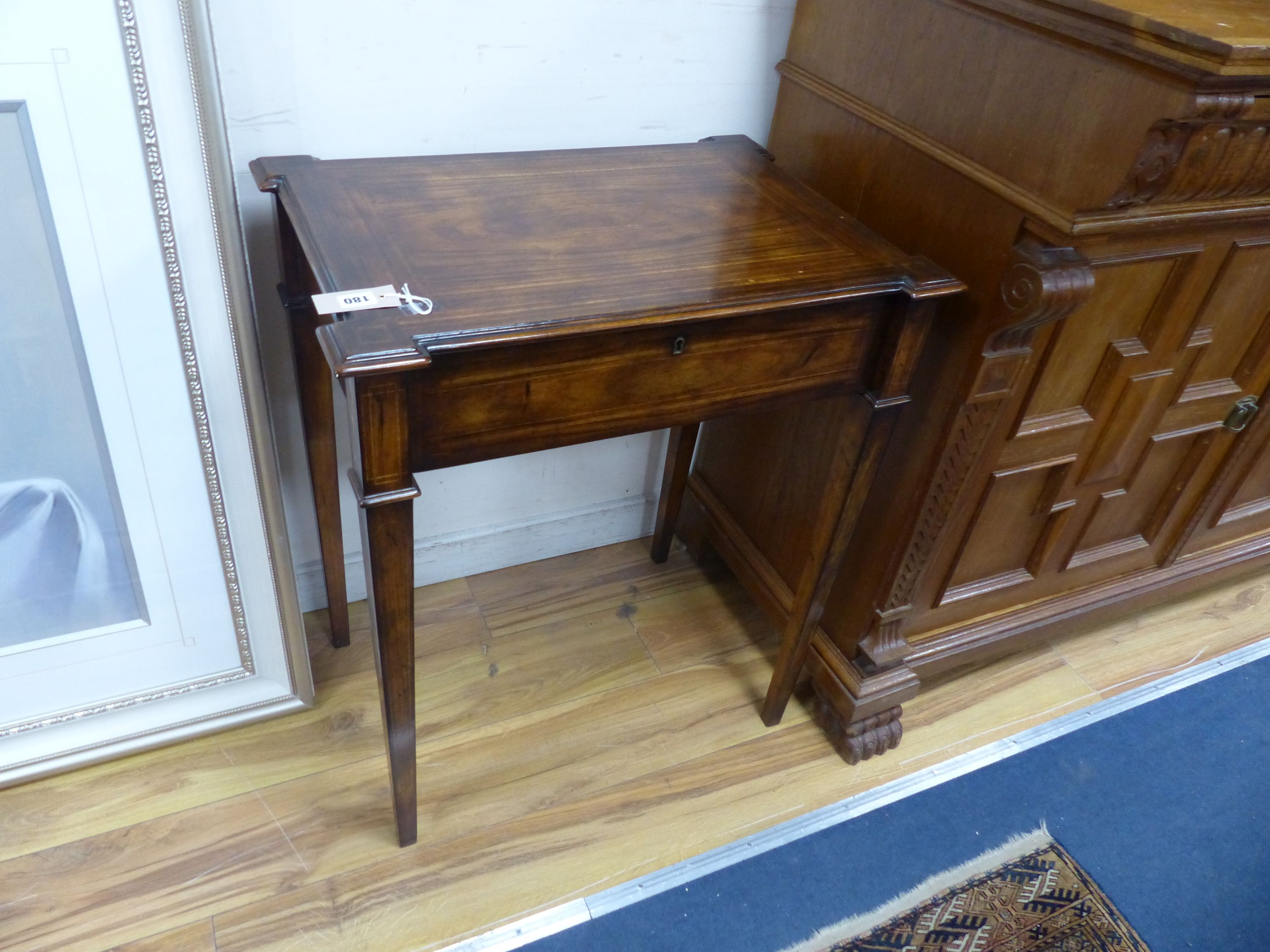 An 18th century style rectangular walnut hinge top enclosed dressing table, width 66cm, depth 46cm, height 76cm